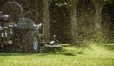 Man operating a zero turn mower